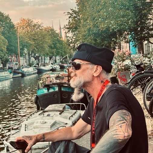 Marcel Smet by an Amsterdam canal at dusk